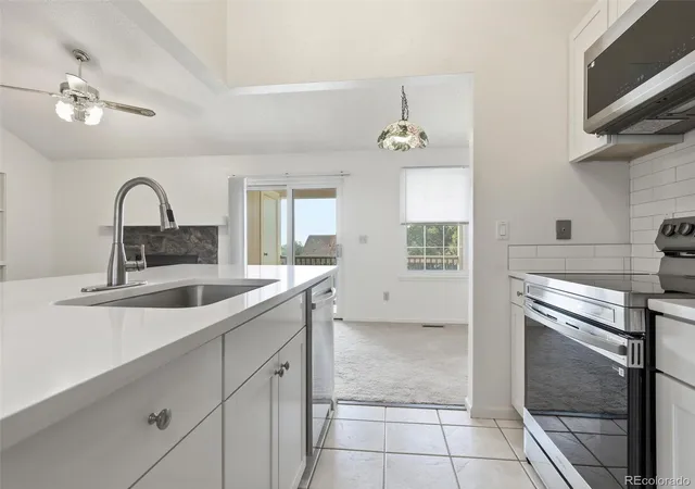 Listing Photo 1 - Condo for sale in building located at 7700 Depew St, Arvada, CO 80003 - Unit #1524