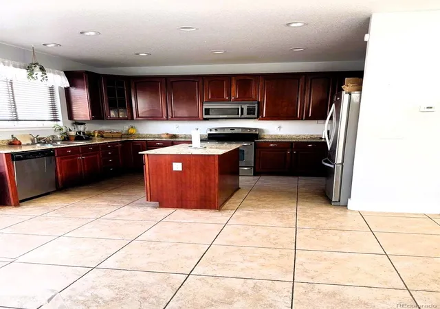 Photo 3 of Single family home for sale at 9826 Nucla St, Commerce City, CO | MLS# 6480200 | Listing updated on 2026-10-05