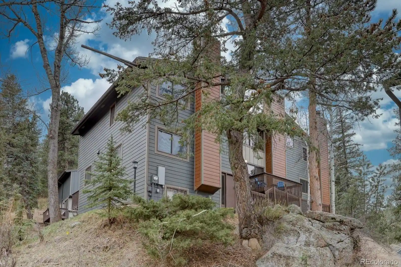 Listing Photo 1 - Condo for sale in 4885 Silver Spruce Ln located at 4885 Silver Spruce Ln, Evergreen, CO 80439 - Unit 4885 Silver Spruce Ln