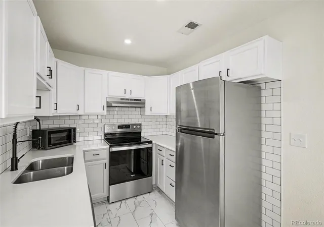 Photo 2 of Townhouse for sale at 3200 S Federal Blvd #2-5, Denver, CO 80236 | MLS# 7215957 | Listing updated on 2026-10-03