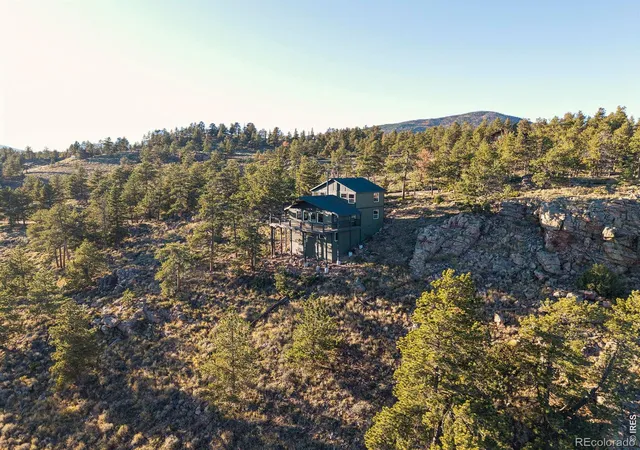 Photo 1 of Single family home for sale at 1074 Caddo Rd, Red Feather Lakes, CO 80545 | MLS# IR1056558 | Listing updated on 2026-09-23