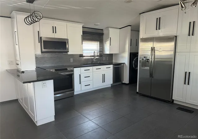 Photo 3 of Manufactured home for sale at 14470 E 13th Avenue, Aurora, CO 80011 | MLS# 4292537 | Listing updated on 2026-10-27