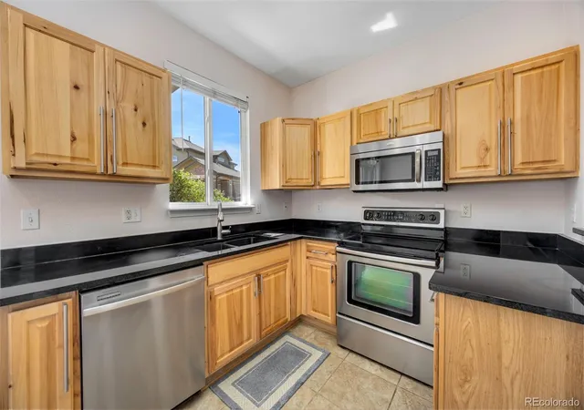 Listing Photo 1 - Condo for sale in building located at 6446 Silver Mesa Dr, Highlands Ranch, CO 80126 - Unit #D