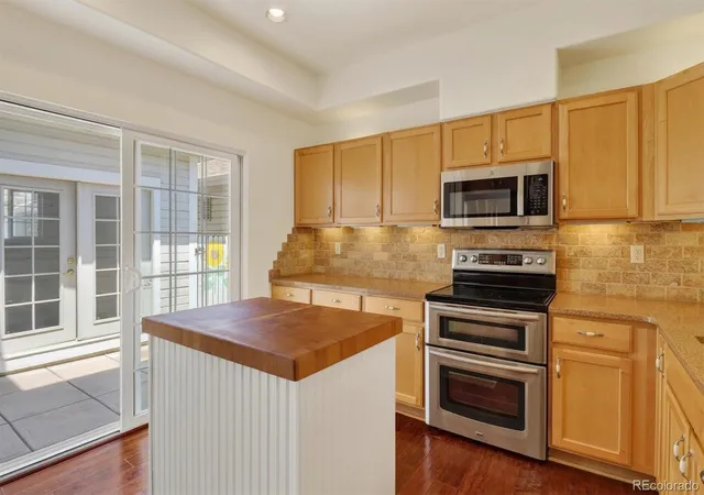 Photo 3 of Townhouse for sale at 8300 E Fairmount Dr #NN102, Denver, CO 80247 | MLS# 9415868 | Listing updated on 2026-10-01