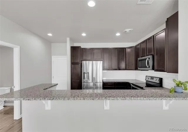 Photo 4 of Townhouse for sale at 1756 S Buchanan Cir, Aurora, CO 80018 | MLS# 8339093 | Listing updated on 2026-07-25