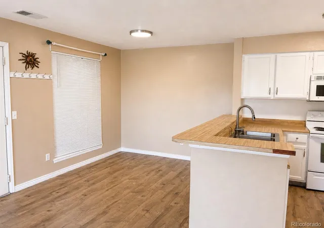 Listing Photo 3 - Condo for sale in building located at 4480 S Pitkin St, Aurora, CO 80015 - Unit #127