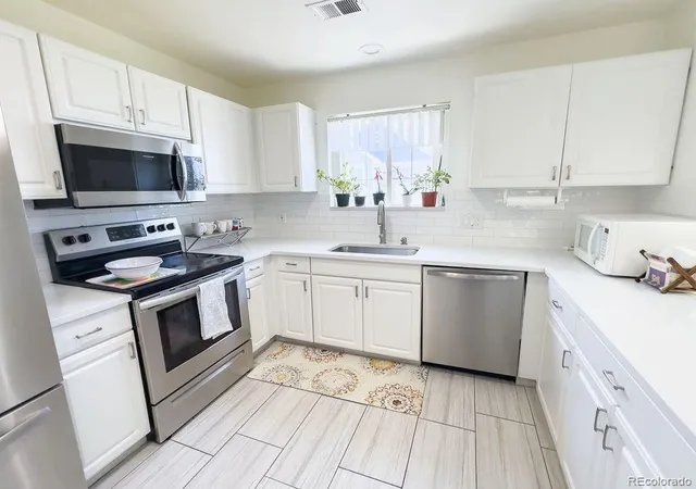 Photo 1 of Townhouse for sale at 19163 E Wyoming Dr #105, Aurora, CO 80017 | MLS# 9319084 | Listing updated on 2026-10-10