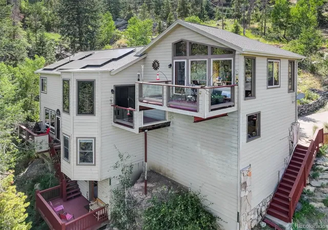 Photo 3 of Single family home for sale at 1255 Hy Vu Dr, Evergreen, CO 80439 | MLS# 7659332 | Listing updated on 2026-09-22
