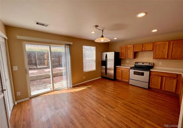 Photo 3 of Townhouse for sale at 9311 Welby Rd, Thornton, CO 80229 | MLS# 7623776 | Listing updated on 2026-08-31