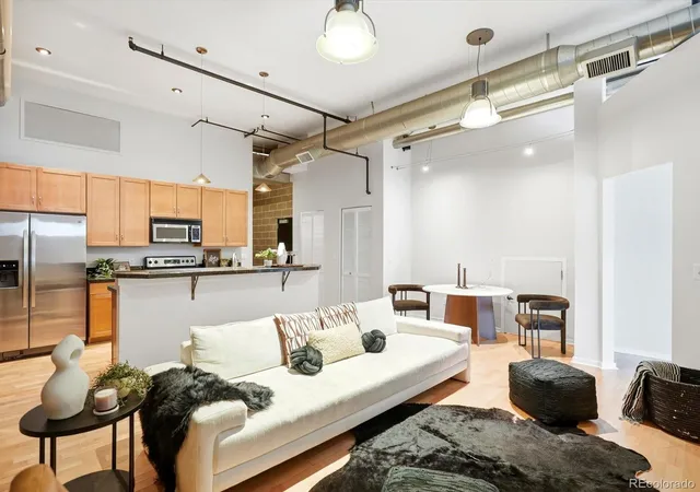 Listing Photo 1 - Condo for sale in building located at 2142 Curtis St, Denver, CO 80205 - Unit #102
