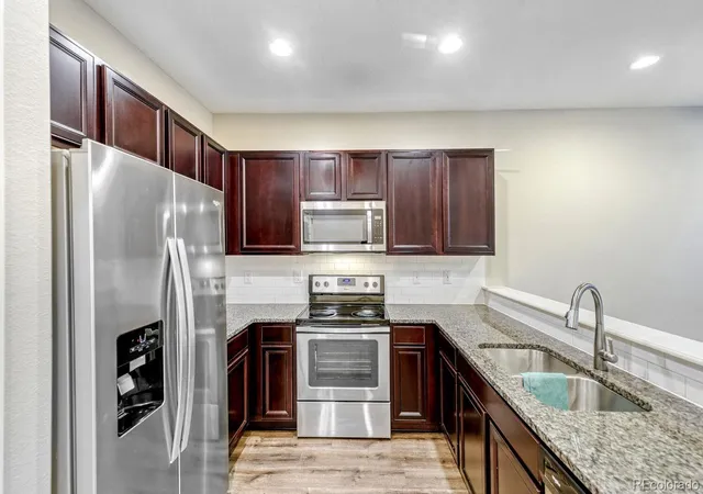 Photo 3 of Townhouse for sale at 16061 E Warner Pl, Denver, CO 80239 | MLS# 8523358 | Listing updated on 2026-10-07