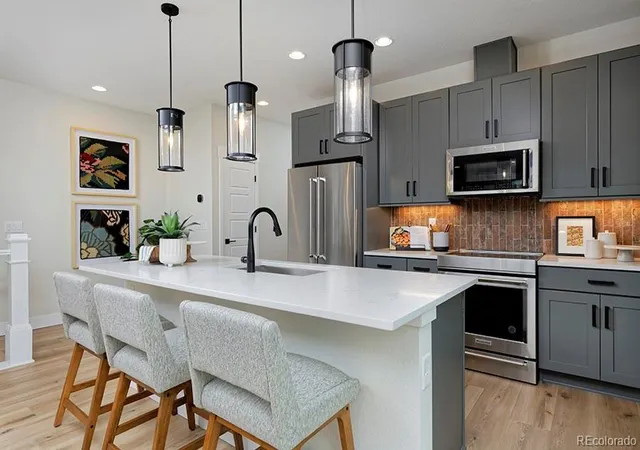 Photo 1 of Townhouse for sale at 3145 W Bates Ave, Denver, CO 80236 | MLS# 7246270 | Listing updated on 2026-09-14