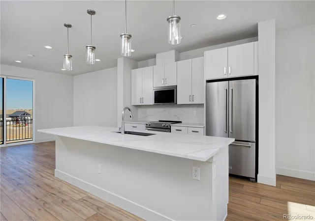 Photo 2 of Townhouse for sale at 3139 W Bates Ave, Denver, CO 80236 | MLS# 4492522 | Listing updated on 2026-09-14