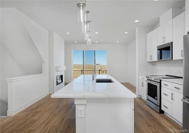 Photo 3 of Townhouse for sale at 3139 W Bates Ave, Denver, CO 80236 | MLS# 4492522 | Listing updated on 2026-09-14