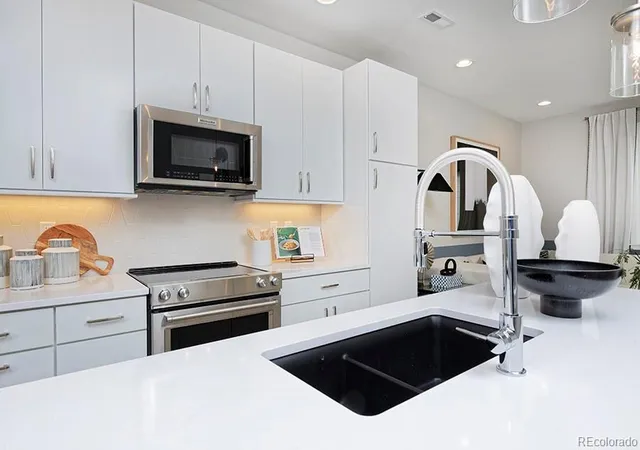 Photo 2 of Townhouse for sale at 3141 W Bates Ave, Denver, CO 80236 | MLS# 8411433 | Listing updated on 2026-09-14