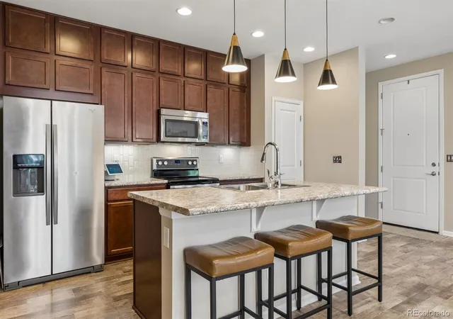Photo 4 of Townhouse for sale at 1212 S Clinton St, Denver, CO 80247 | MLS# 8681887 | Listing updated on 2026-09-13