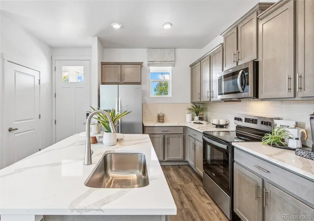 Photo 3 of Townhouse for sale at 1410 S Boston Ct #B, Denver, CO 80247 | MLS# 6692396 | Listing updated on 2026-09-02