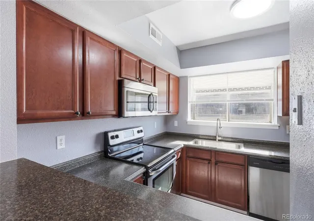 Photo 3 of Townhouse for sale at 8199 Welby Rd #1406, Denver, CO 80229 | MLS# 5385488 | Listing updated on 2026-08-19