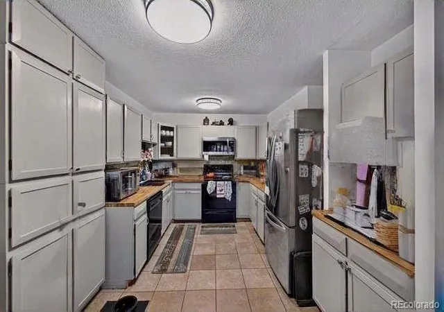 Photo 1 of Condo for sale at 9380 E Center Ave #1B, Denver, CO 80247 | MLS# 6566813 | Listing updated on 2026-10-01