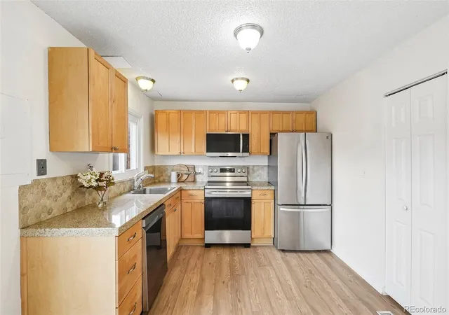 Listing Photo 2 - Condo for sale in building located at 5835 S Lowell Blvd, Littleton, CO 80123