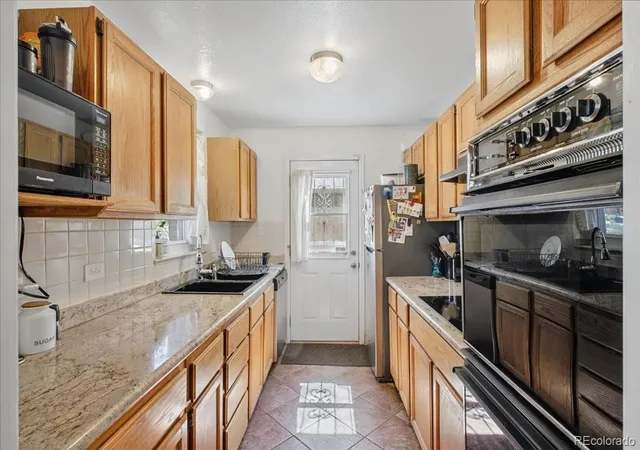 Photo 3 of Single family home for sale at 1341 Florence St, Aurora, CO 80010 | MLS# 8926763 | Listing updated on 2026-10-10