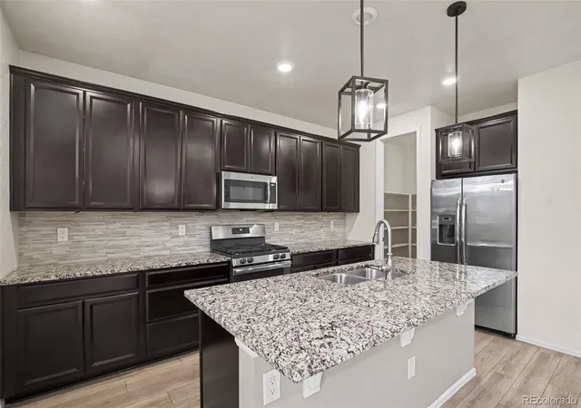 Photo 3 of Single family home for sale at 10931 Uvalda St, Commerce City, CO 80022 | MLS# 3928689 | Listing updated on 2026-09-26