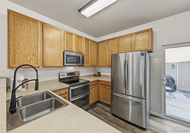 Photo 3 of Townhouse for sale at 15612 E 96th Way #17E, Commerce City, CO 80022 | MLS# 1688585 | Listing updated on 2026-10-09
