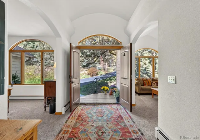 Photo 2 of Single family home for sale at 302 Cottonwood Dr, Evergreen, CO 80439 | MLS# 9779201 | Listing updated on 2026-10-07