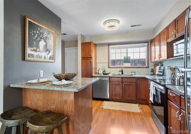 Listing Photo 4 - Condo for sale in building located at 3451 S Ammons St, Lakewood, CO 80227 - Unit #16-4