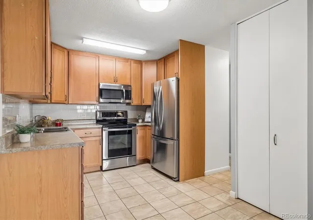Photo 3 of Condo for sale at 9360 E Center Ave #12A, Denver, CO 80247 | MLS# 8537549 | Listing updated on 2026-10-11