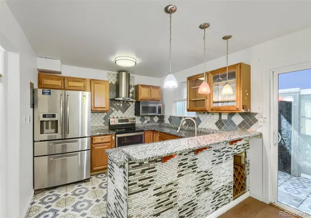 Photo 2 of Townhouse for sale at 11761 E Canal Dr, Aurora, CO 80011 | MLS# 9384424 | Listing updated on 2026-10-26