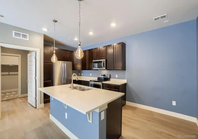 Listing Photo 2 - Condo for sale in building located at 15345 W 64th Ln, Arvada, CO 80007 - Unit #106
