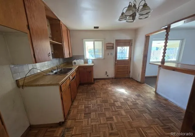Photo 2 of Single family home for sale at 1027 Troy St, Aurora, CO 80011 | MLS# 8384479 | Listing updated on 2026-10-27
