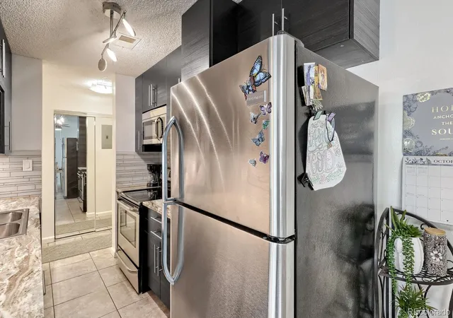 Photo 3 of Condo for sale at 7755 E Quincy Ave #308, Denver, CO 80237 | MLS# 2438465 | Listing updated on 2026-10-26