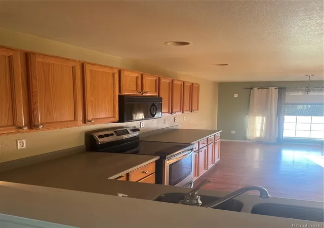 Photo 2 of Single family home for sale at 13118 Clayton Ct, Thornton, CO 80241 | MLS# 2303902 | Listing updated on 2026-10-21