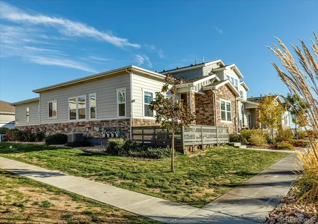 Listing Photo 1 - Condo for sale in building located at 15501 E 112th Ave, Commerce, CO 80022 - Unit #7A