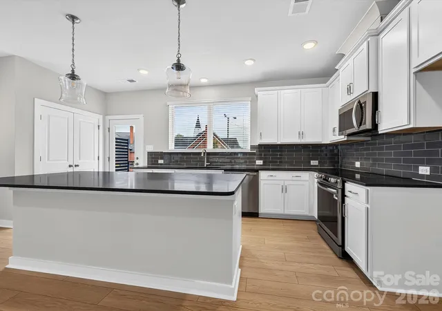 Photo 3 of Townhouse for sale at 1128 Bismuth Ln, Charlotte, NC 28211 | MLS# 4352904 | Listing updated on 2026-10-07