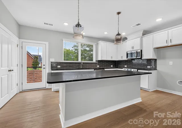 Photo 3 of Townhouse for sale at 1128 Bismuth Ln, Charlotte, NC 28211 | MLS# 4352904 | Listing updated on 2026-10-28