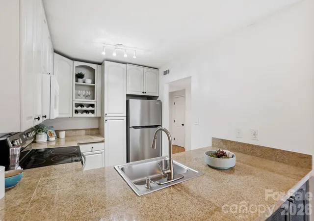 Photo 4 of Condo for sale at 1616 Flynnwood Dr #F, Charlotte, NC 28205 | MLS# 4391410 | Listing updated on 2026-09-21
