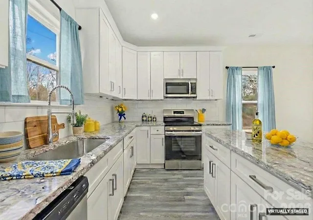 Photo 2 of Single family home for sale at 115 S Railroad Ave, East Spencer, NC 28039 | MLS# 4394930 | Listing updated on 2026-09-26