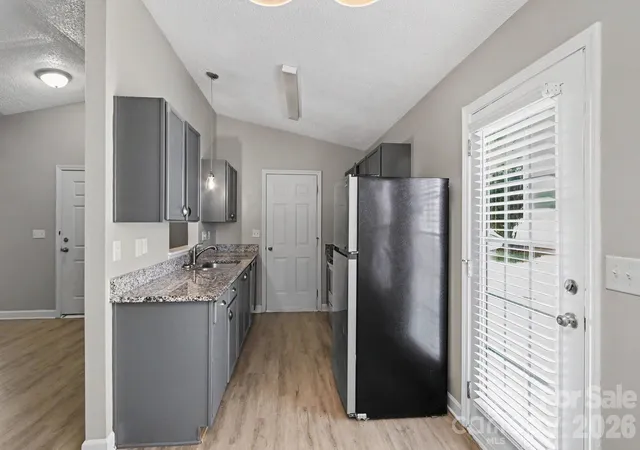 Photo 3 of Single family home for sale at 7035 Red Bud Cir, Charlotte, NC 28214 | MLS# 4406173 | Listing updated on 2026-08-20