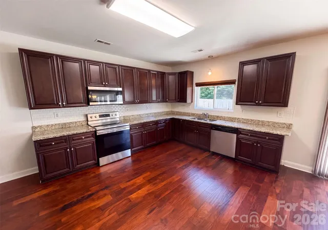 Photo 2 of Single family home for sale at 14021 Pinyon Pine Ln, Charlotte, NC 28215 | MLS# 4420081 | Listing updated on 2026-10-08
