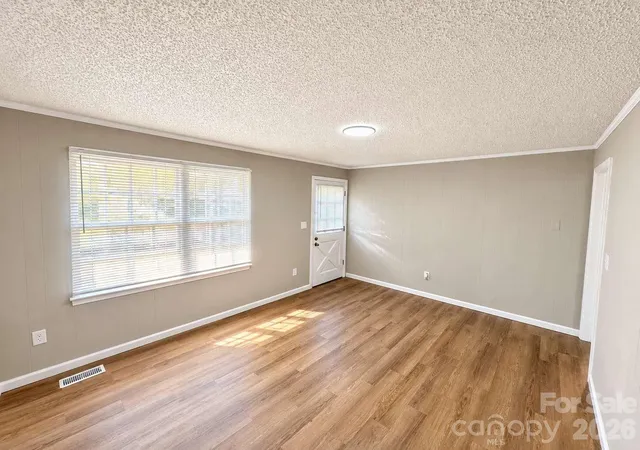 Photo 3 of Single family home for sale at 99 N Mcginnis Pl, Mount Holly, NC 28120 | MLS# 4424141 | Listing updated on 2026-10-01
