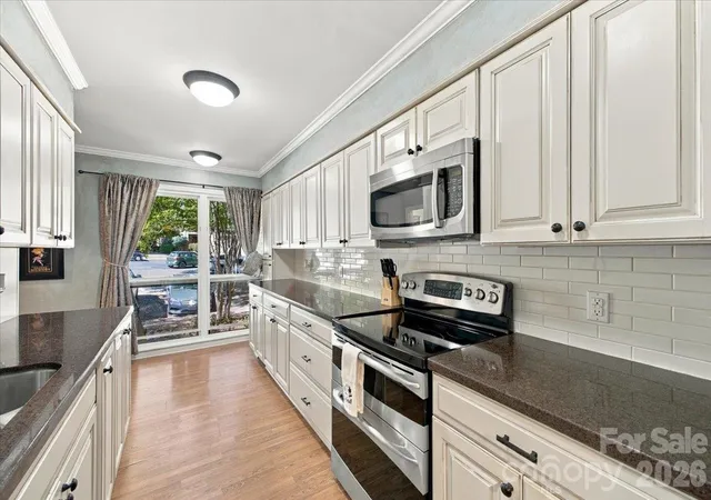 Photo 3 of Condo for sale at 5805 Sharon Rd #E, Charlotte, NC 28210 | MLS# 4432363 | Listing updated on 2026-10-09