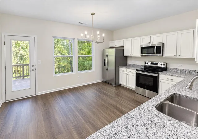 Photo 1 of Single family home for sale at 7006 Wandering Crk Dr, Charlotte, NC 28216 | MLS# 4437500 | Listing updated on 2026-10-24