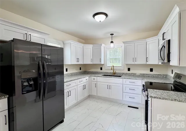 Photo 4 of Single family home for sale at 405 E Lyerly St, Granite Quarry, NC 28072 | MLS# 4438327 | Listing updated on 2026-10-29
