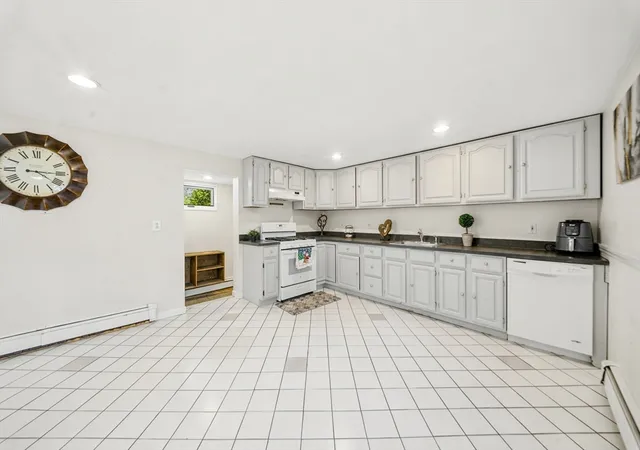 Photo 2 of Multi family home for sale at 14-16 Moore St, Quincy, MA 02169 | MLS# 73569399 | Listing updated on 2026-09-17