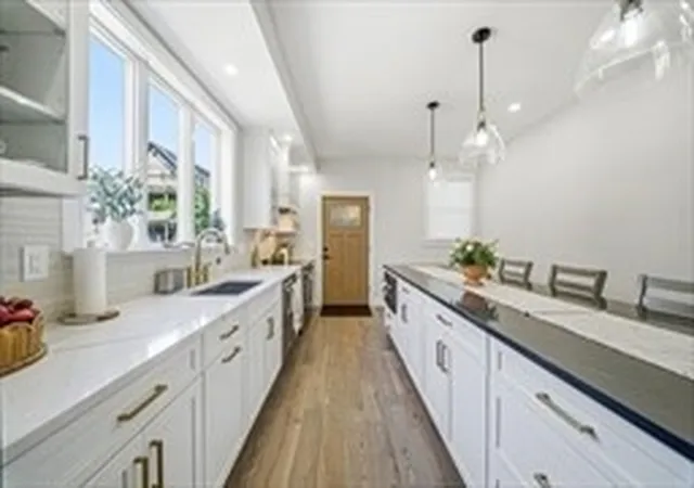 Photo 3 of Multi family home for sale at 61 Wayland St, Dorchester, MA 02125 | MLS# 73534721 | Listing updated on 2026-07-10
