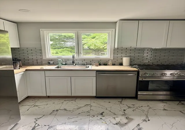 Photo 3 of Multi family home for sale at 150 Grove St, West Roxbury, MA 02132 | MLS# 73552286 | Listing updated on 2026-09-13