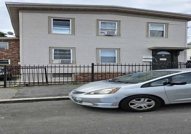 Photo 2 of Multi family home for sale at 12 Warren St, Lawrence, MA 01841 | MLS# 73570079 | Listing updated on 2026-09-07